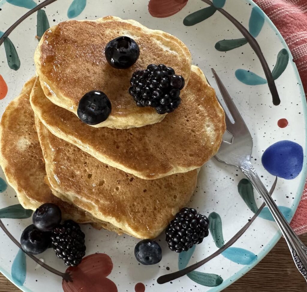 Sourdough discard pancakes with berries and syrup