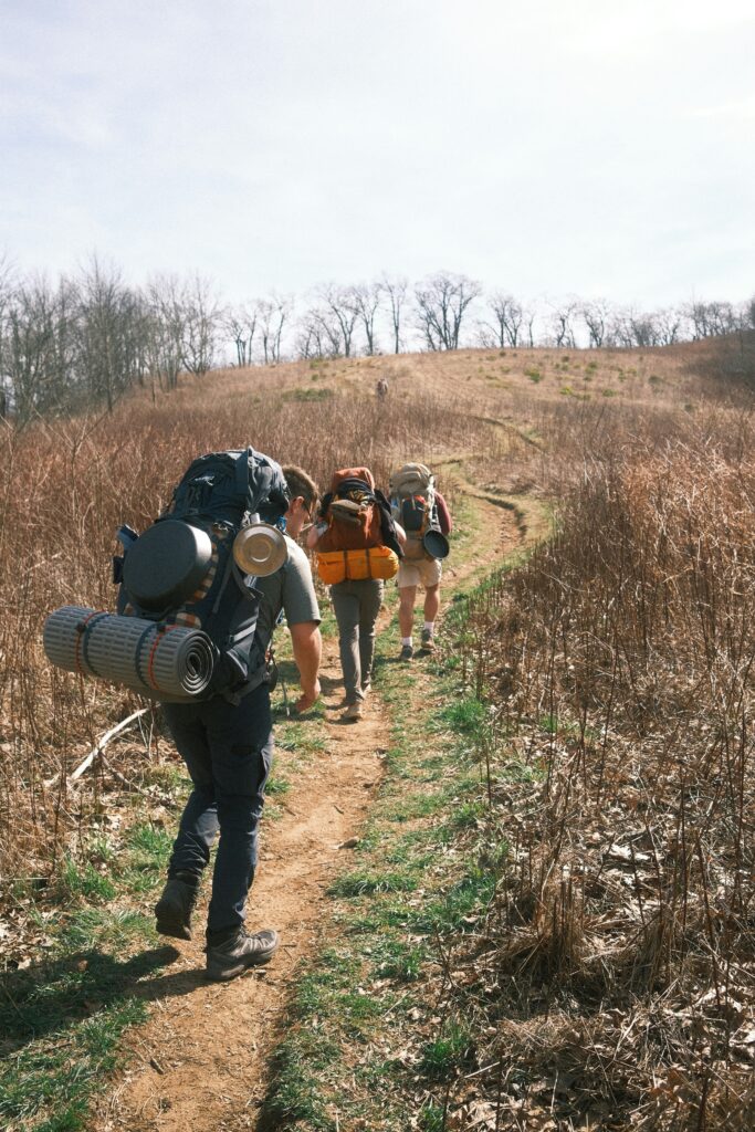 Backpacking up a brown hill